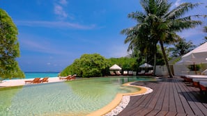 Outdoor pool, pool umbrellas, sun loungers