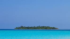 On the beach, white sand, beach towels, waterskiing