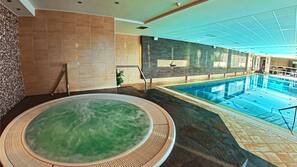 Indoor pool, seasonal outdoor pool, pool umbrellas, pool loungers
