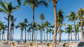 On the beach, sun loungers, beach towels, beach massages