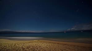 On the beach, white sand, beach cabanas, sun-loungers