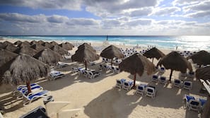 On the beach, sun loungers, beach umbrellas, beach towels