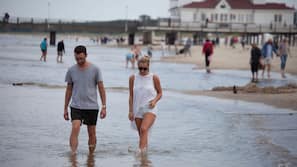 On the beach, white sand, beach towels