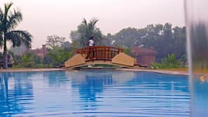 2 outdoor pools, pool umbrellas, pool loungers
