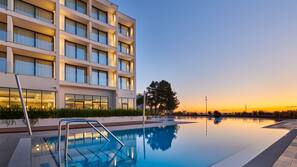 Seasonal outdoor pool, pool umbrellas, pool loungers