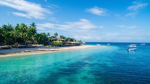Private beach, white sand, sun loungers, beach umbrellas
