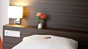 Luxe beddengoed, pillowtop-bedden, een kluis op de kamer