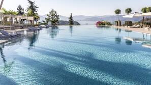 Indoor pool, outdoor pool, free pool cabanas, pool loungers