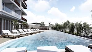 Seasonal outdoor pool, pool loungers
