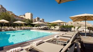 Seasonal outdoor pool, open 7:00 AM to 10:00 PM, pool umbrellas