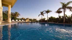 Outdoor pool, open 8 AM to 6 PM, pool umbrellas, sun loungers