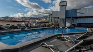 Outdoor pool, open 8:00 AM to 8:00 PM, pool loungers