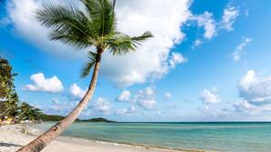 On the beach, sun-loungers, beach umbrellas, beach towels