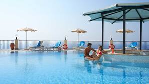 2 outdoor pools, pool umbrellas, pool loungers