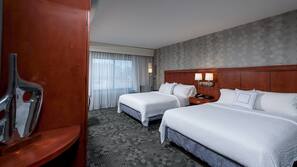 Premium bedding, pillow-top beds, desk, laptop workspace