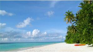 Private beach, white sand, sun loungers, beach umbrellas