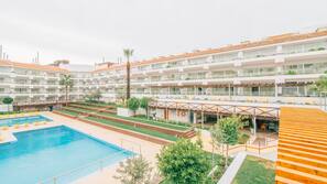 Indoor pool, outdoor pool, pool umbrellas, pool loungers