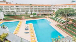 Indoor pool, outdoor pool, pool umbrellas, pool loungers