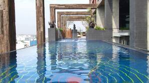 Outdoor pool, open 7:00 AM to 9:00 PM, pool umbrellas, sun loungers