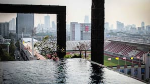 Outdoor pool, open 7:00 AM to 9:00 PM, pool umbrellas, sun loungers