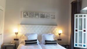Ropa de cama de alta calidad, minibar, caja fuerte