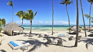 Private beach, white sand, sun loungers, beach umbrellas
