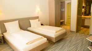 Luxe beddengoed, een minibar, een kluis op de kamer, een bureau