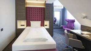 Luxe beddengoed, een minibar, een kluis op de kamer, een bureau