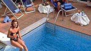 Seasonal outdoor pool, pool umbrellas, pool loungers