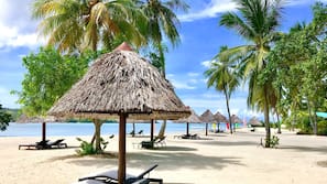 Private beach, sun-loungers, beach towels, beach massages