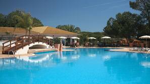 Indoor pool, outdoor pool, pool umbrellas