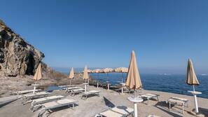 Private beach, black sand, beach cabanas, sun-loungers