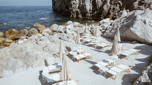Private beach, black sand, beach cabanas, sun-loungers