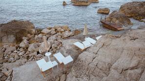 Private beach, black sand, beach cabanas, sun-loungers