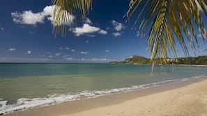 On the beach, sun loungers, beach umbrellas, beach towels