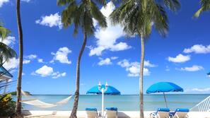 On the beach, sun loungers, beach umbrellas, beach towels