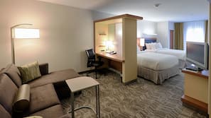 Premium bedding, desk, laptop workspace, blackout drapes