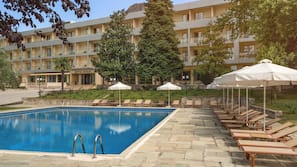 Indoor pool, outdoor pool, pool umbrellas, pool loungers