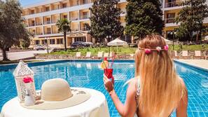 Indoor pool, outdoor pool, pool umbrellas, pool loungers