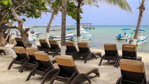 Private beach, beach umbrellas, beach towels, beach bar