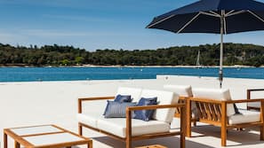 On the beach, sun-loungers, beach umbrellas, beach towels