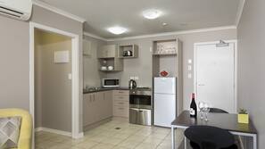 Fridge, microwave, coffee/tea maker, cookware/dishes/utensils
