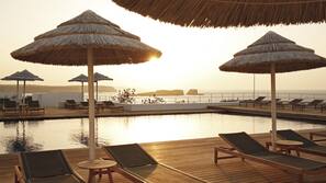 Indoor pool, outdoor pool, pool umbrellas, pool loungers