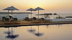 Indoor pool, outdoor pool, pool umbrellas, pool loungers