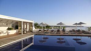 Indoor pool, outdoor pool, pool umbrellas, pool loungers