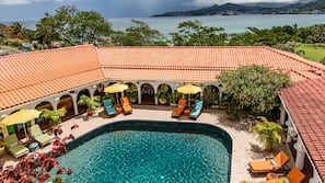 Outdoor pool, pool umbrellas, sun loungers