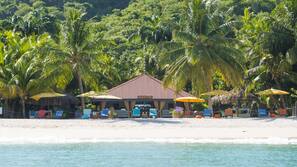 On the beach, white sand, free beach cabanas, sun loungers