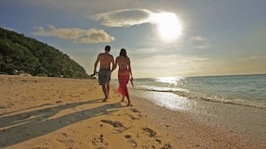 Beach nearby, white sand, beach umbrellas, beach towels