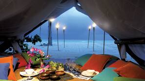 Beach nearby, white sand, beach umbrellas, beach towels