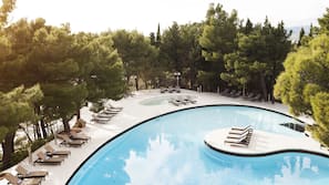 Indoor pool, seasonal outdoor pool, pool umbrellas, pool loungers